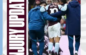 Emiliano Buendía limps off vs Man City with foot injury; seen on crutches and in a protective boot photo